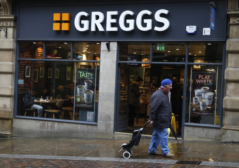 © Reuters. A man walks past a Greggs bakery in Bradford, Britain