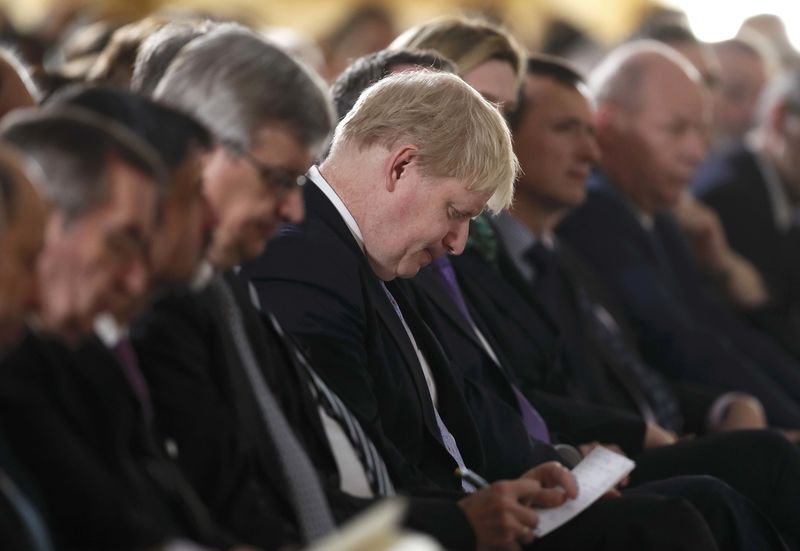 © Reuters. Foreign Secretary Boris Johnson listens as Britain's Prime Minister Theresa May delivers a speech on leaving the European Union at Lancaster House in London