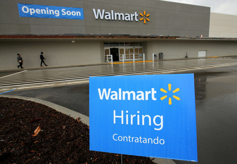 © Reuters. FILE PHOTO - Job postings are shown outside a new Walmart Super Center as the company opens its first store in Compton, California