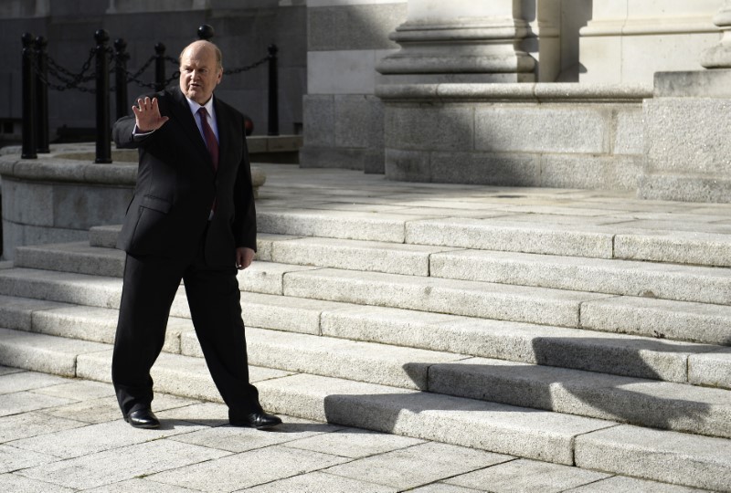 © Reuters. Ireland's Minister for Finance Michael Noonan gestures on the steps of Government Buildings in Dublin