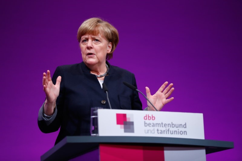 © Reuters. German Chancellor Merkel delivers a speech during the yearly DBB union meeting in Cologne