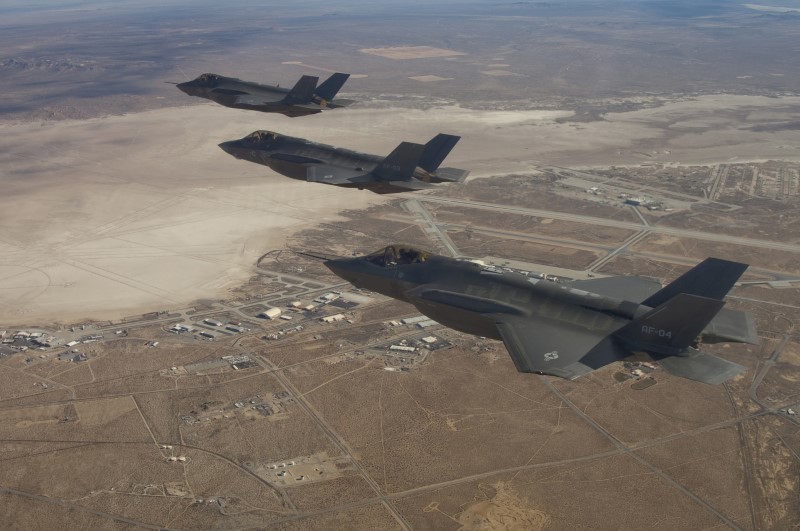 © Reuters. Handout photo of three F-35 Joint Strike Fighters flying over Edwards Air Force Base