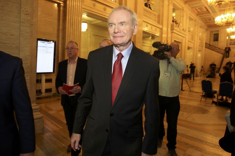 © Reuters. Northern Ireland's former Deputy First Minister Martin McGuinness leaves Assembly at Parliament Buildings in Stormont in Belfast