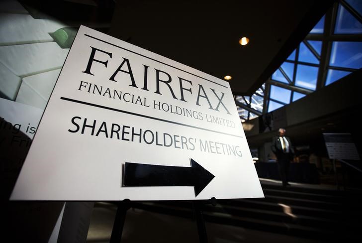 © Reuters. A man walks past a Fairfax Holdings sign directing shareholders to the meeting, at the annual general meeting for shareholders in Toronto