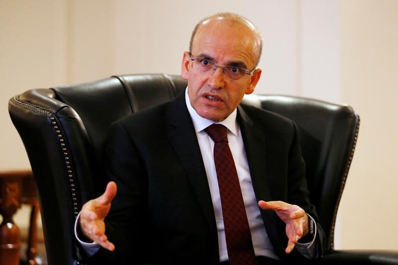 © Reuters. Turkey's Deputy Prime Minister Mehmet Simsek speaks during an interview with Reuters in Ankara