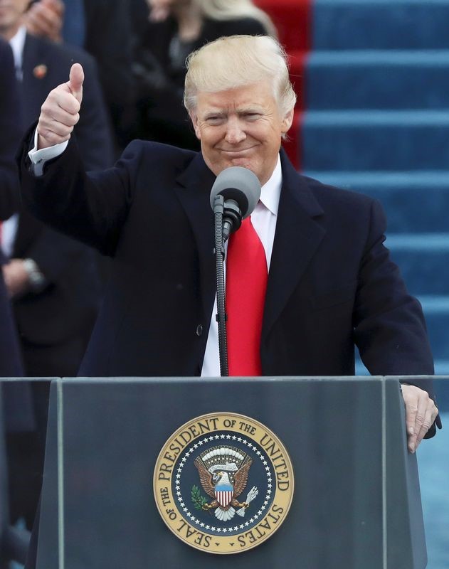 © Reuters. President Donald Trump waves after taking the oath at inauguration ceremonies swearing in Trump as the 45th president of the United States on the West front of the U.S. Capitol in Washington