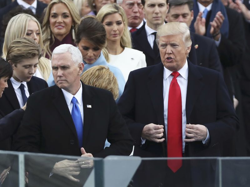 © Reuters. President elect Donald Trump and Vice President elect Mike Pence prepare to be sworn in during inauguration ceremonies swearing in Trump as the 45th president of the United States on the West front of the U.S. Capitol in Washington