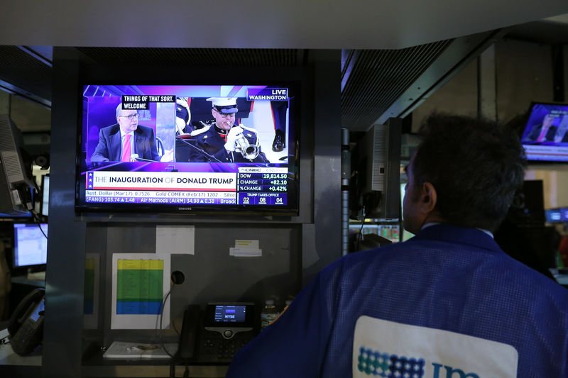 © Reuters. A trader watches the Trump inauguration on TV on the floor of the New York Stock Exchange (NYSE) in Manhattan, New York City