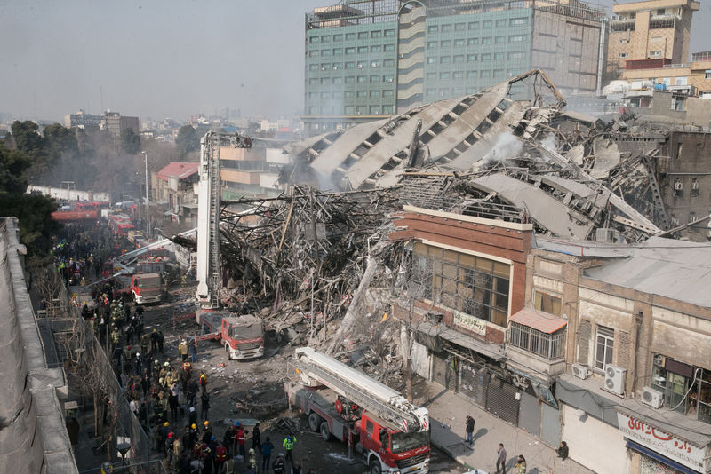 © Reuters. Collapsed building is seen in Tehran