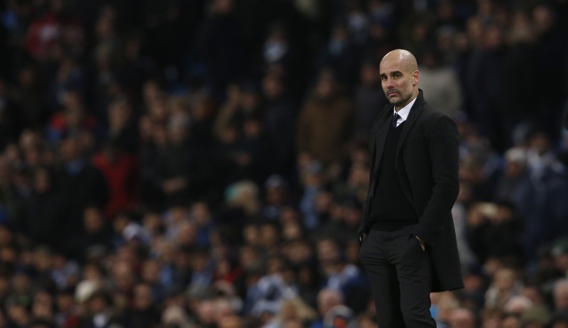 © Reuters. Manchester City manager Pep Guardiola looks dejected