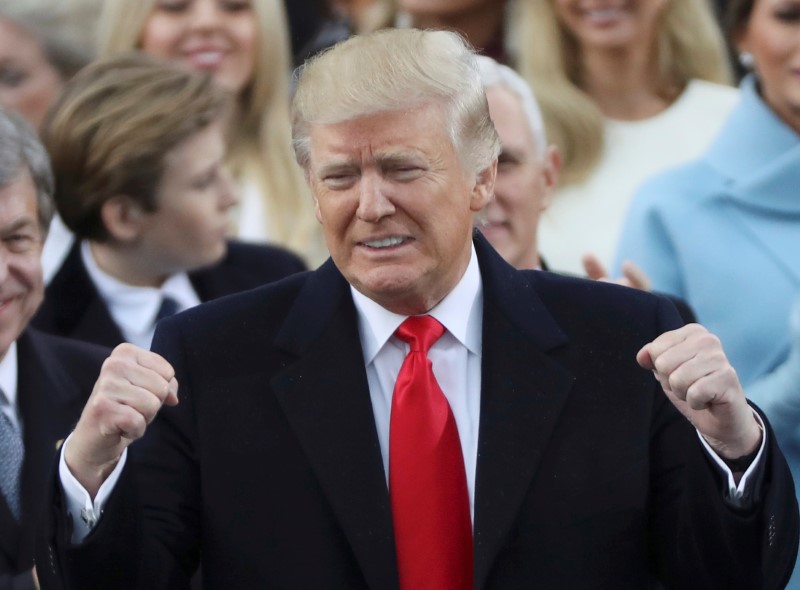 © Reuters. FILE PHOTO: President Donald Trump celebrates after inauguration ceremonies swearing him in as the 45th president of the United States on the West front of the U.S. Capitol in Washington