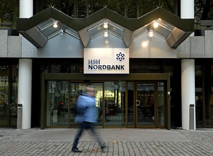 © Reuters. A pedestrian walks past the HSH Nordbank building in downtown Hamburg