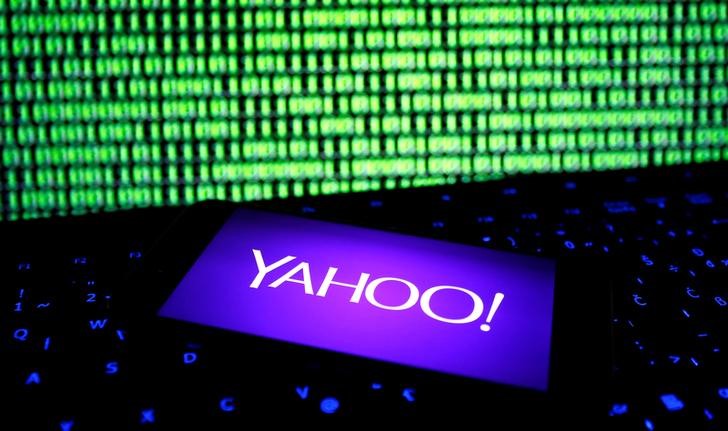 © Reuters. A photo illustration shows a Yahoo logo on smartphone in front of a displayed cyber code and keyboard