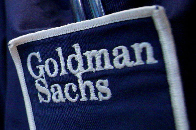 © Reuters. FILE PHOTO - The logo of Dow Jones Industrial Average stock market index listed company Goldman Sachs (GS) is seen on the clothing of a trader working at the Goldman Sachs stall on the floor of the New York Stock Exchange