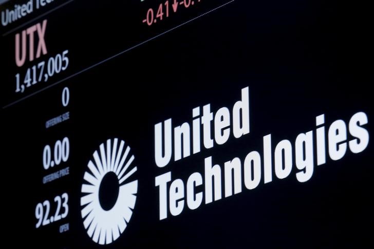 © Reuters. The ticker symbol for for United Technologies is displayed at the post where it is traded  on the floor of the NYSE