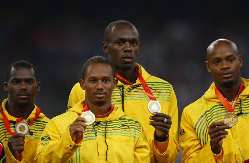 © Reuters. Bolt pierde el oro olímpico de Pekín en relevos tras dar positivo un compañero