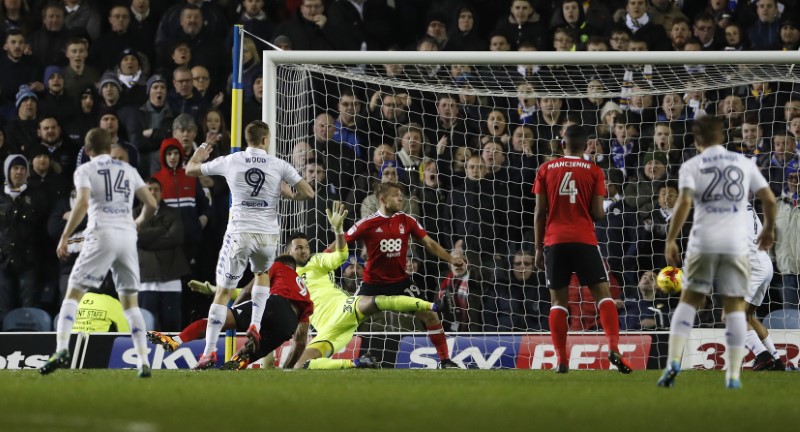 © Reuters. Leeds' Chris Wood scores their first goal