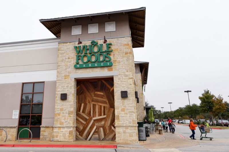 © Reuters. Customers are seen outside a Whole Foods Market in Austin