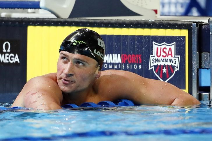 © Reuters. Ryan Lochte reacts after the men's freestyle 200m finals in the U.S. Olympic swimming team trials at CenturyLink Center in Omaha
