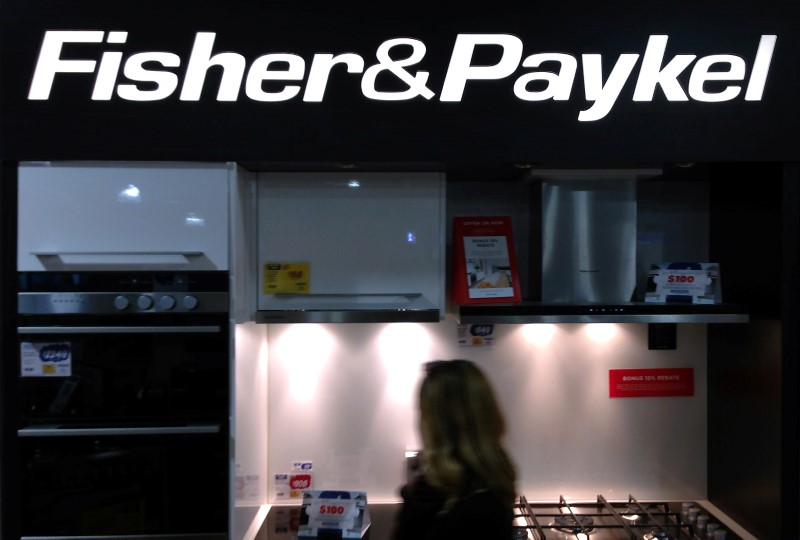 © Reuters. A customer walks past a display for Fisher & Paykel kitchen appliances at a department store in Sydney, Australia