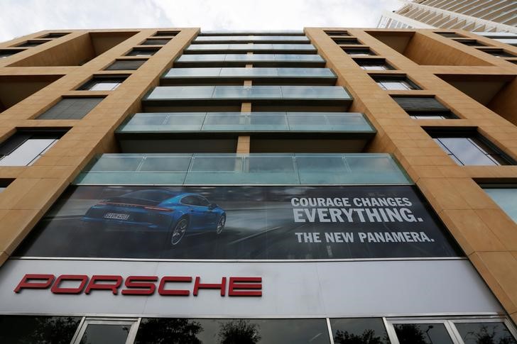 © Reuters. The logo of German car manufacturer Porsche is seen outside a showroom of a Porsche dealer in Beirut