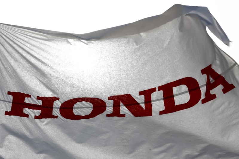 © Reuters. A flag with the company logo flies outside the Honda Motor Co. plant in Yorii