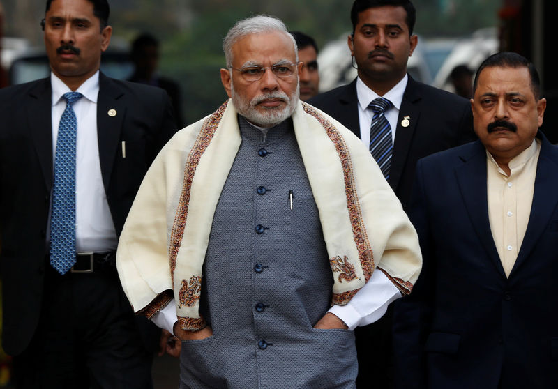 © Reuters. Prime Minister Modi walks to speak with the media as he arrives at the parliament house to attend the first day of the budget session, in New Delhi