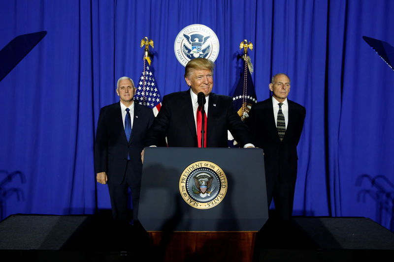 © Reuters. U.S. President Trump takes the stage to deliver remarks at Homeland Security headquarters in Washington