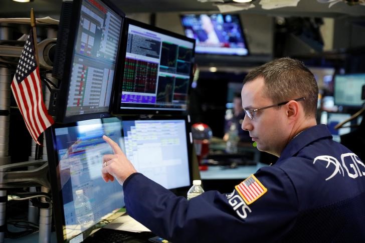 © Reuters. A trader works on the floor of the New York Stock Exchange (NYSE) shortly after the opening bell in New York
