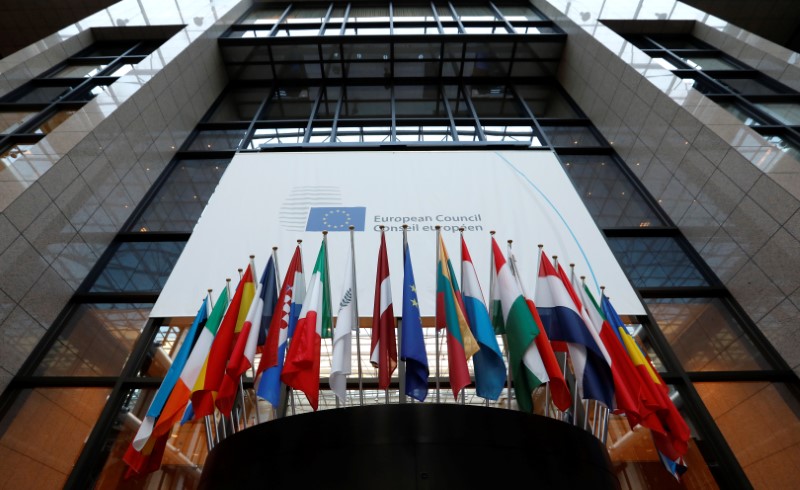 © Reuters. Flags are seen inside the European Council headquarters on the eve of a EU Summit in Brussels