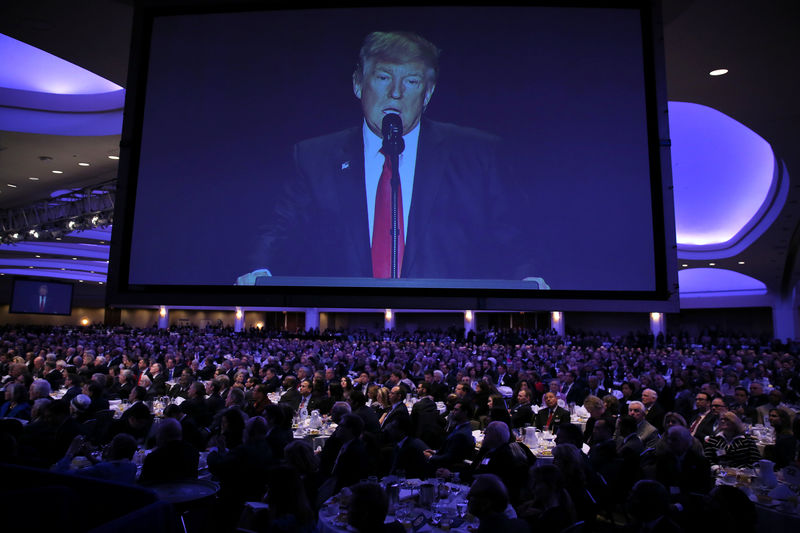 © Reuters. U.S. President Donald Trump is seen on a screen as he delivers remarks at the National Prayer Breakfast in Washington