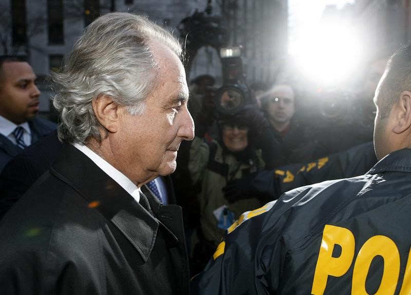 © Reuters. Bernard Madoff  departs US Federal Court after a hearing in New York