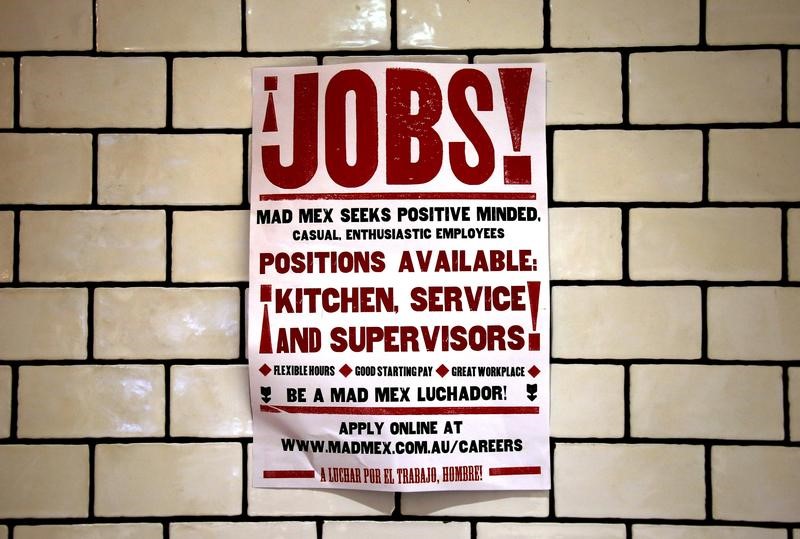 © Reuters. File picture of a job advert for a local fast food outlet hanging on a wall in a shopping center located in central Sydney, Australia