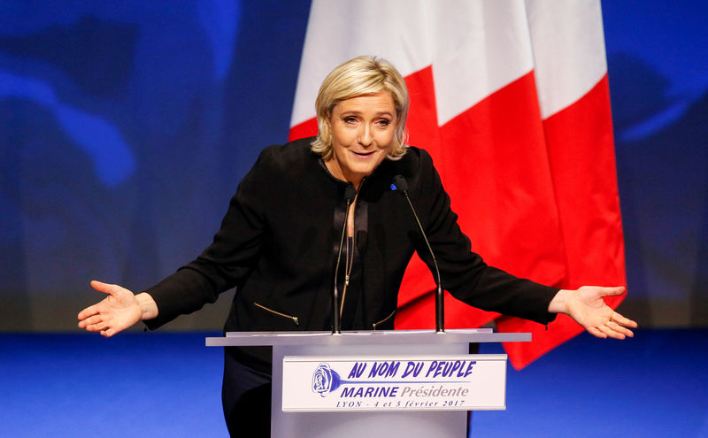 © Reuters. Marine Le Pen, FN political party leader and candidate for the French 2017 presidential election, attends the 2-day FN political rally to launch the presidential campaign in Lyon