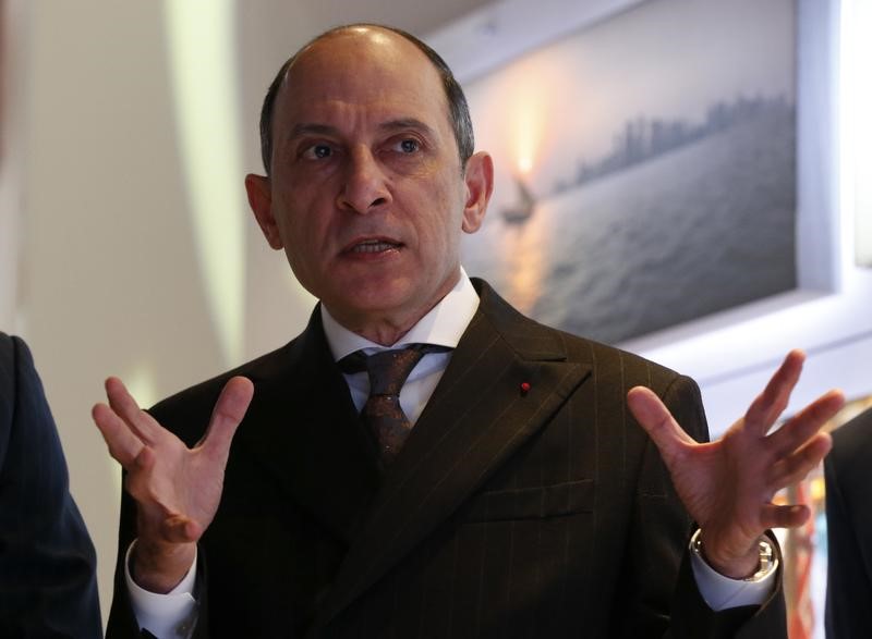 © Reuters. Qatar Airways Chief Executive Akbar Al Baker gestures as he tours the stand of company at the International Tourism Trade Fair in Berlin