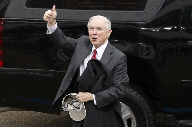 © Reuters. U.S. Attorney General-nominee, Senator Jeff Sessions (R-AL) reacts after the inauguration of President Donald Trump in Washington