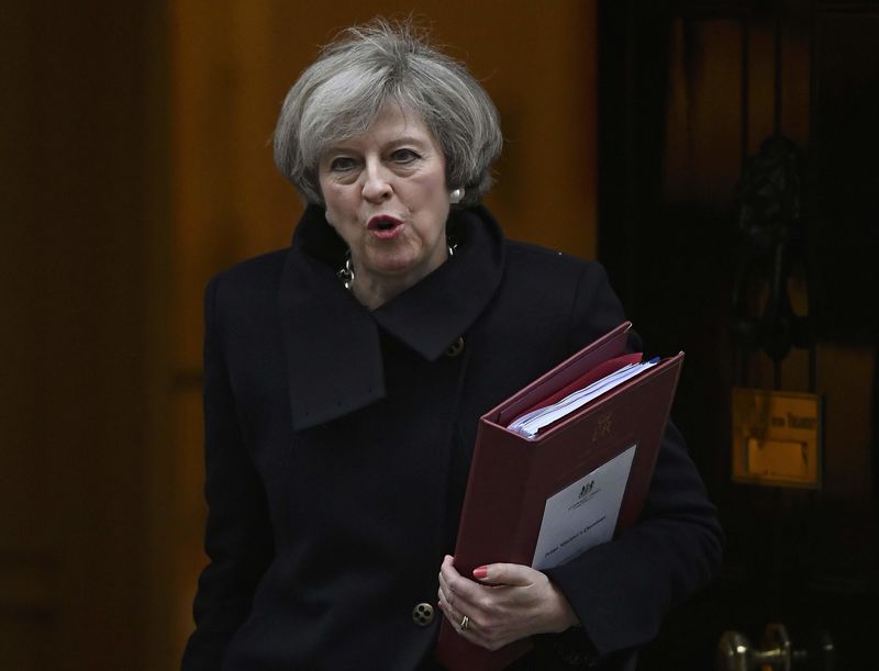 © Reuters. Britain's Prime Minister Theresa May leaves Number 10 Downing Street to attend Prime Minister's Questions at parliament in London