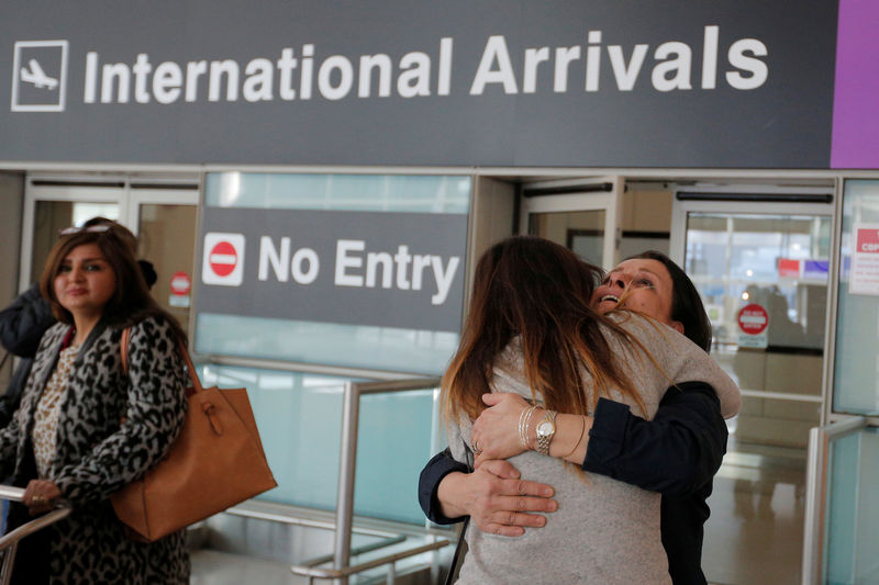 © Reuters. Shanez Tabarsi is greeted by her daughter Negin after traveling to the U.S. from Iran following a federal court's temporary stay of U.S. President Donald Trump's executive order travel ban at Logan Airport in Boston