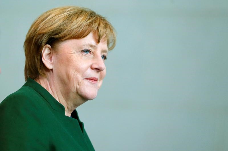 © Reuters. German Chancellor Merkel arrives, after talking with Uruguayan President Vazquez, for a news conference at the Chancellery in Berlin