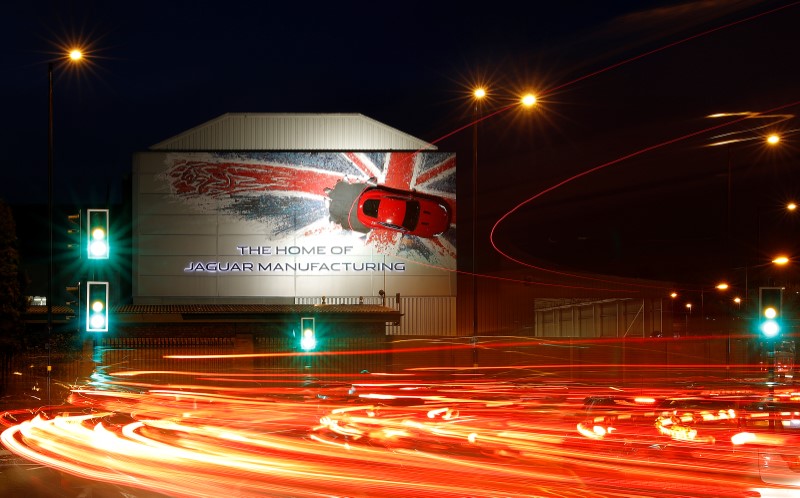 © Reuters. A car hangs on the wall of Jaguar's Castle Bromwich manufacturing facility in Birmingham