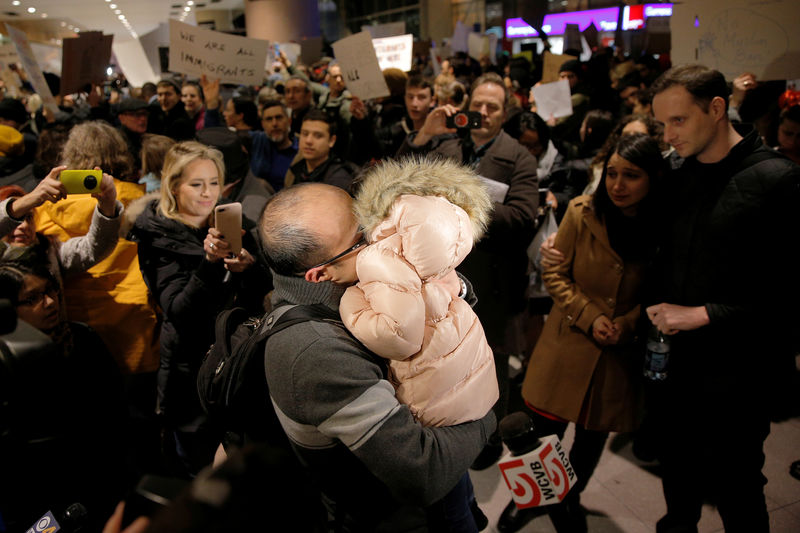 © Reuters. The Bay family is reunited after Hamed Bay was separated from other passengers and questioned as a result of U.S. Donald Trump's executive order travel ban at Logan Airport in Boston