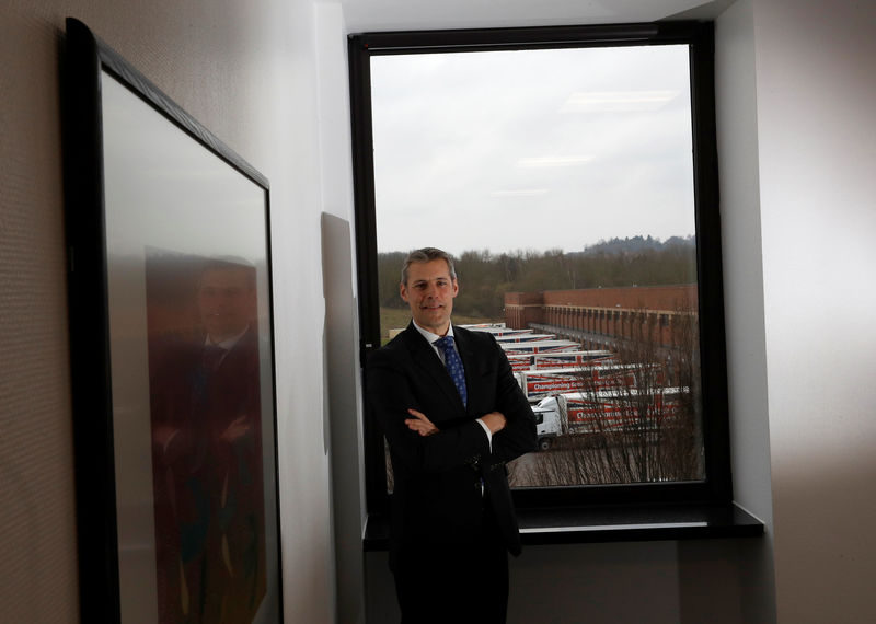 © Reuters. Aldi Chief Executive Matthew Barnes poses at Aldi's distribution centre in Atherstone