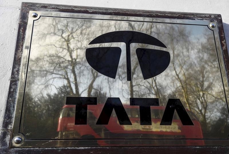 © Reuters. File photo of bus reflected in a Tata sign outside their offices in London