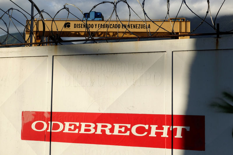 © Reuters. The corporate logo of Odebrecht is seen next to a text in a structure that reads "Designed and made in Venezuela" in a construction site in Caracas