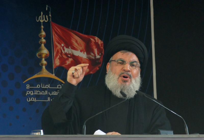 © Reuters. Lebanon's Hezbollah leader Sayyed Hassan Nasrallah addresses his supporters during a public appearance at a religious procession to mark Ashura in Beirut's southern suburbs