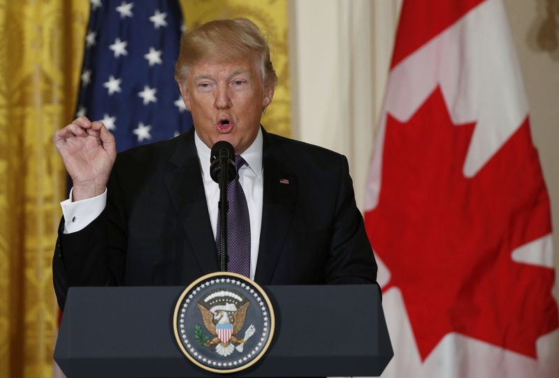 © Reuters. U.S. President Donald Trump addresses joint news conference with Trudeau at the White House in Washington