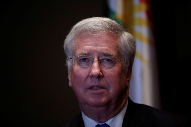 © Reuters. British Defence Secretary Michael Fallon speaks to the media during his press conference in Erbil