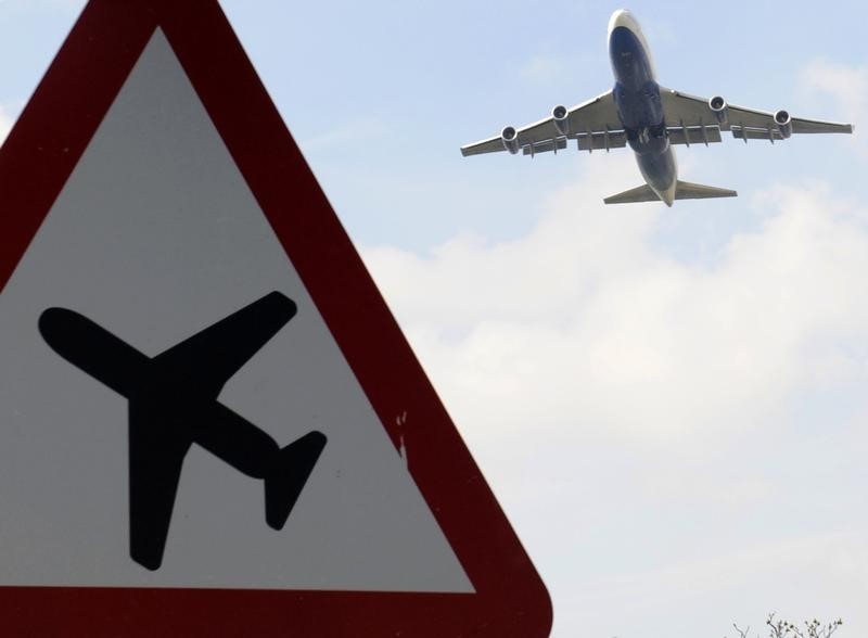 © Reuters. A jumbo jet takes off shortly before midday from Heathrow Airport in west London