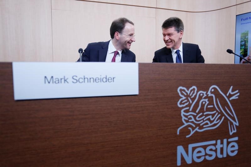 © Reuters. New Nestle CEO Schneider and CFO Roger after a news conference at the company headquarters in Vevey