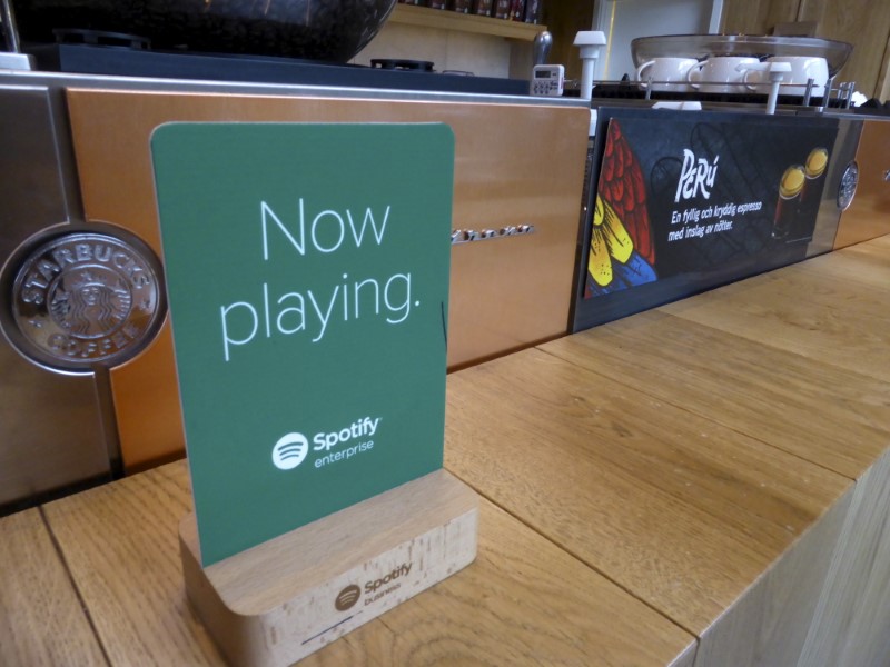 © Reuters. Start-up Soundtrack Your Brand, which has music streaming service Spotify as one of its investors, has a sign displayed in a Starbucks cafe in Stockholm